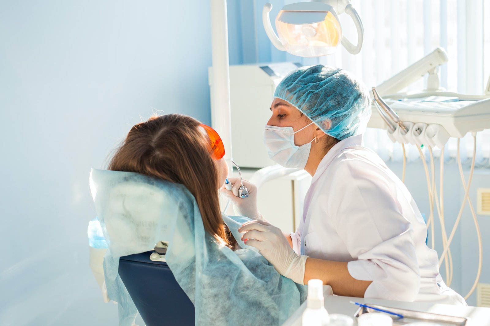 Dental clinician examining a patient in a modern dental practice
