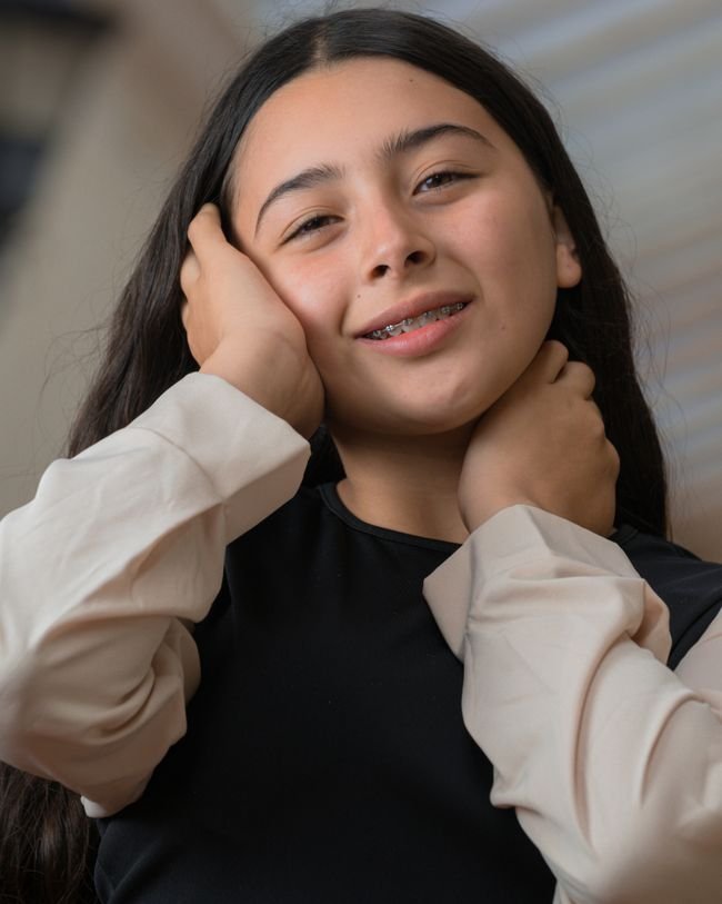 Teenager smiling with braces — illustrative stock photo