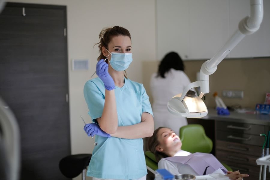 Orthodontic clinician consulting with patient — illustrative stock photography